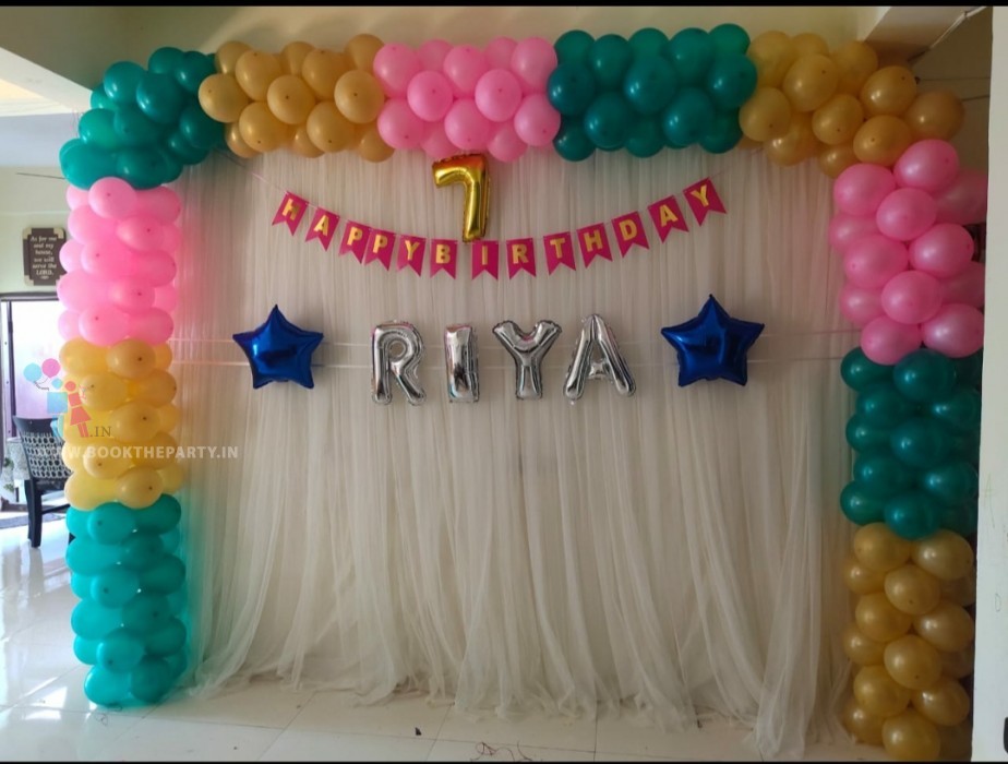 White Drapes with Banner and Foil Balloons 