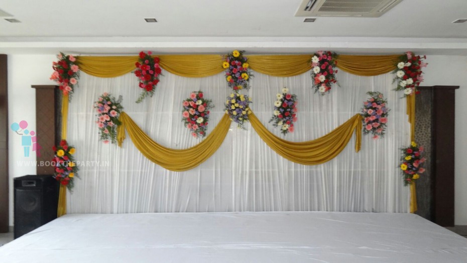 Gold And White Drapes Backdrop With Bouquets 