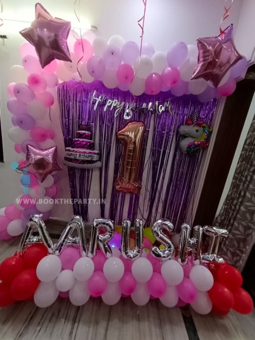 Pink and purple balloons decor with streamers