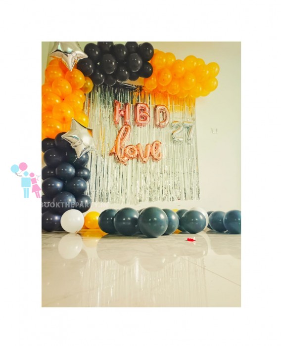 Black and yellow balloons decor with streamers