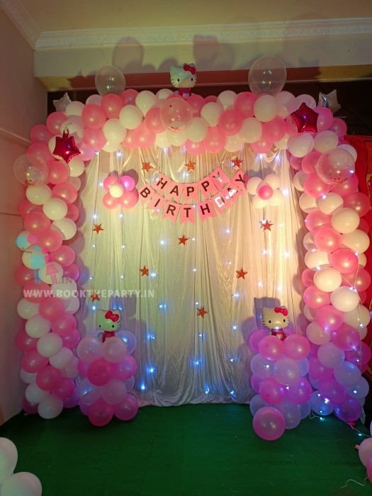 Pink and white balloons decor with Cloth drapes