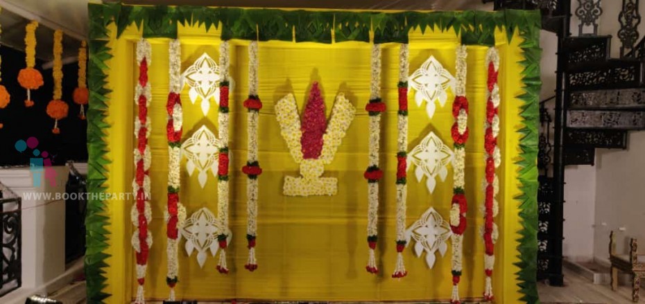 Yellow Drapes with Namam & Garlands Hanging 