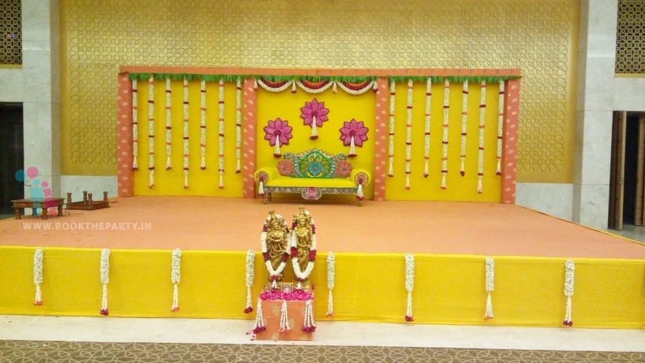 Traditional Backdrop with Yellow Drapes and Garlands 