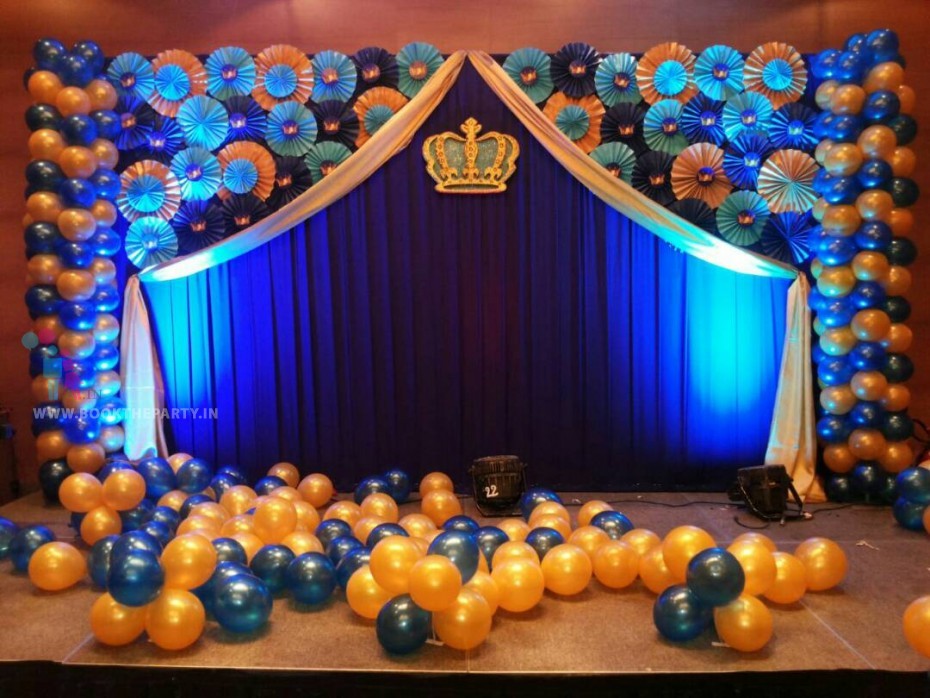 Blue Drapes with Paper Fans and Crown 