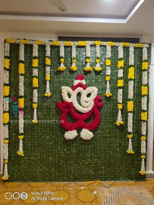 Ganesh with Coconut Mat & Garlands Hanging 