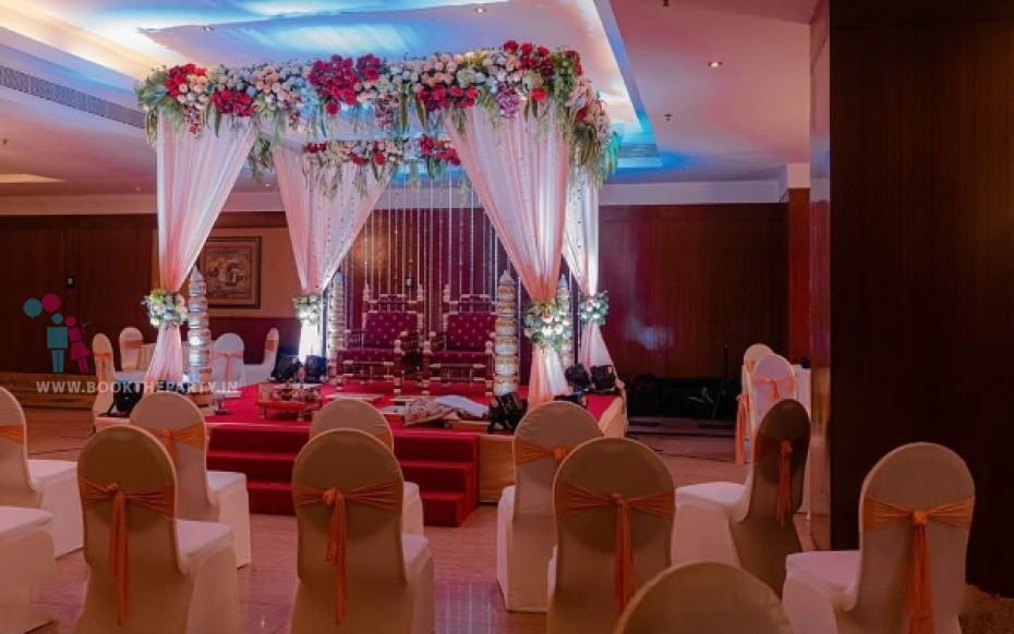 Mandapam with Peach Drapes and Natural Floral Decor 