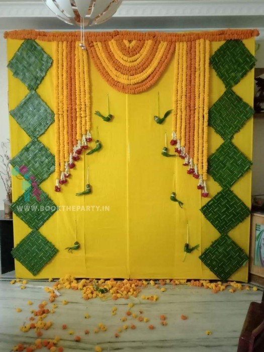 Yellow Drapes with Marigold Flowers and Parrot Hangings 